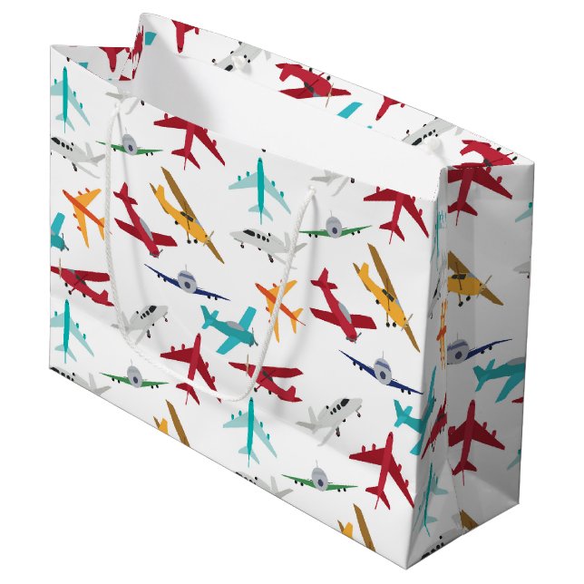 Muster für farbenfrohe Flugzeuge Große Geschenktüte (Vorderseite Schrägansicht)