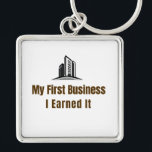 My First Business Keychain – I Earned It – Proud F Schlüsselanhänger<br><div class="desc">Celebrate the pride of launching your very first business! This keychain features the bold phrase "My First Business – I Earned It", perfect for anyone who worked hard to achieve this milestone. Whether it’s a startup, small business, or entrepreneurial venture, this keychain is a fun and meaningful reminder of dedication...</div>