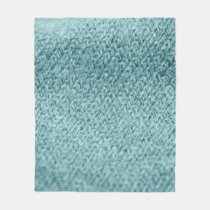 Nah aus grün gestricktem Hintergrund. Fleecedecke