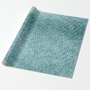 Nah aus grün gestricktem Hintergrund. Geschenkpapier