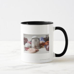 Nahaufnahme der Knöpfe mit einer Metallkappe Tasse