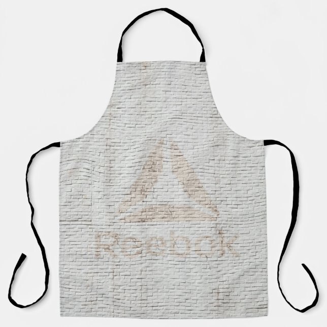Nahes Foto des Reebok-Logos an der Wand Schürze (Vorderseite)