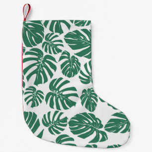 Nahtloses Muster mit Blätter von Monstera. Decorat Kleiner Weihnachtsstrumpf