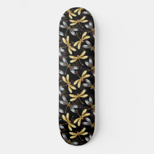 Nahtloses Muster mit goldenen Libellen Skateboard