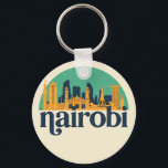 Nairobi Kenya City Skyline Retro City Art Schlüsselanhänger<br><div class="desc">Vintages und retro City Design mit wunderschöner Skyline, touristischer Attraktion und Stadtbild. Cooler Wolkenkratzer und Gebäude Silhouette Illustrationen für Touristen und Reisende. Ideal als Souvenir, um Zuhause zu bringen, wenn Sie um die Welt reisen. Rett die Erinnerung an deine Reise und Ferien mit Familie und Freunden. Die Hintergrundfarbe kann auf...</div>