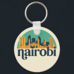 Nairobi Kenya City Skyline Retro City Art Schlüsselanhänger<br><div class="desc">Vintages und retro City Design mit wunderschöner Skyline, touristischer Attraktion und Stadtbild. Cooler Wolkenkratzer und Gebäude Silhouette Illustrationen für Touristen und Reisende. Ideal als Souvenir, um Zuhause zu bringen, wenn Sie um die Welt reisen. Rett die Erinnerung an deine Reise und Ferien mit Familie und Freunden. Die Hintergrundfarbe kann auf...</div>