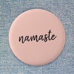 Namaste Peachy Pink Modern Yoga Meditation Button<br><div class="desc">Einfach, stylish "namaste" Art Design in modern minimalist handwritten script typography on pastel peachy pink background. The slogan can easily be personalized with your own words for a perfect gift for a yoga bunny or pilates lover! Namasté literally means "greetings to you". In the Vedas, namaste mostly occurs as grüßte...</div>