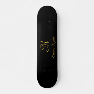 Name des hübschen Schwarz-Gold-Monogram-Skripts Skateboard