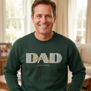 Name des Kindes auf dem T - Shirt des Vaters