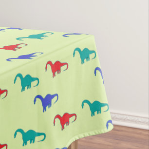 Nappe Dino coloré sur vert