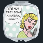 Natural Beauty Comic Book Compact Mirror Taschenspiegel<br><div class="desc">Dieser knechte Kompaktspiegel bringt sicher ein Lächeln in die Lippen. Das inspirierte Design des Comic zeigt einen hübschen Teeny-Bopper mit rotem Lippenstift und eine Sprechblase,  die sagt: "Es ist nicht einfach,  eine natürliche Schönheit zu sein." Das Mädchen und die Sprechblase sind auf einem robinfarbenen,  polka dot hintergrund.</div>
