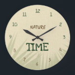 Nature Time Botanical Große Wanduhr<br><div class="desc">This elegant Nature Time wall clock features a natural beige background inspired by burlap fabric and warm earthy tones. Soft shadows of tropical leaves create a calm botanical atmosphere, bringing a touch of nature into your space. The dark green and brown typography blends beautifully with the natural color palette, while...</div>
