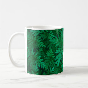 Natürlicher grüner Hintergrund aus grünen Blätter Kaffeetasse