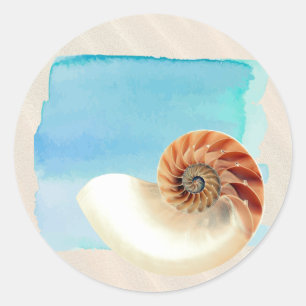 Nautilus Seashell und Sand Runder Aufkleber