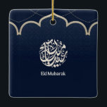 Navy Eid Mubarak Arabic Calligraphy Art Keramikornament<br><div class="desc">An elegant Islamic design featuring intricate Arabic calligraphy set within a refined circular emblem on a deep navy patterned background. A graceful mosque-inspired arch and delicate dotted details add a traditional architectural touch, while the clean “Eid Mubarak” typography completes the celebratory message. The contrast of rich blue and soft beige...</div>