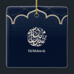 Navy Eid Mubarak Arabic Calligraphy Art Keramikornament<br><div class="desc">An elegant Islamic design featuring intricate Arabic calligraphy set within a refined circular emblem on a deep navy patterned background. A graceful mosque-inspired arch and delicate dotted details add a traditional architectural touch, while the clean “Eid Mubarak” typography completes the celebratory message. The contrast of rich blue and soft beige...</div>