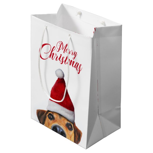 Neugieriger Niedlicher Hund mit Weihnachtsmannmütz Mittlere Geschenktüte (Vorderseite Schrägansicht)