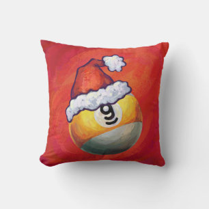 Neun Ball in Weihnachtsmannmütze über Rot Kissen