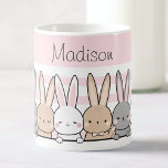 Niedlich Bunnies Personalisiert Kaffeetasse<br><div class="desc">Genießen Sie Ihre Lieblingsgetränke in stilvollem Ambiente mit dieser zauberhaften individuelle Name-Tasse. Freuen Sie sich auf eine hübsche Reihe niedlicher Bräuche mit einem zarten, rosa Hintergrund. Diese hochwertige Tasse ist perfekt für Kinder und Tierliebhaber geeignet und kann mit jedem Namen personalisiert werden. Ob Morgenkaffee, Nachmittagstee oder heiße Schokolade, diese Tasse...</div>
