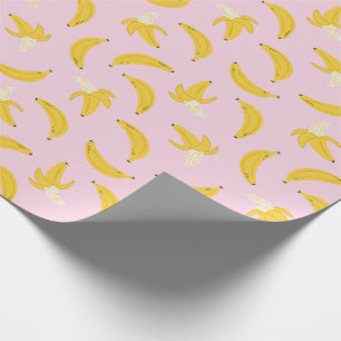 Niedliche Bananen in hellrosa Geschenkpapier