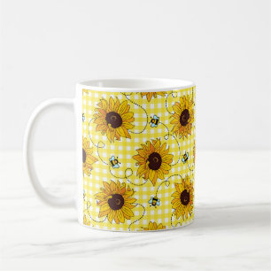 Niedliche Bienen und Sonnenblumen auf einem karier Kaffeetasse