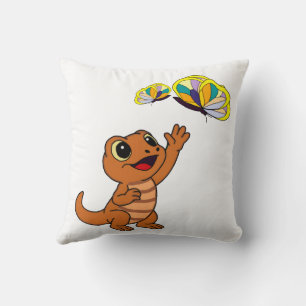 Niedliche braune Cartoon-Echse greift nach Schmett Kissen