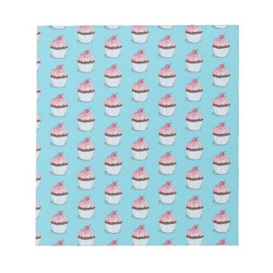 Niedliche Cupcakes im blauen Hintergrund Notizblock