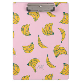 Niedliche Gelbbananen mit Monogramm im rosa Hinter Klemmbrett