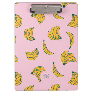 Niedliche Gelbbananen mit Monogramm im rosa Hinter Klemmbrett