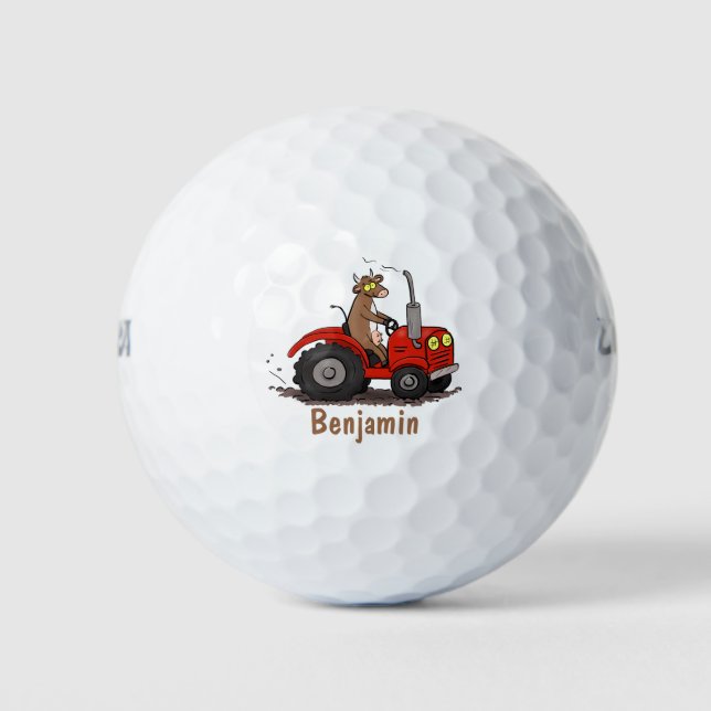 Niedliche glückliche Kuh, die einen roten Traktor- Golfball (Vorderseite)