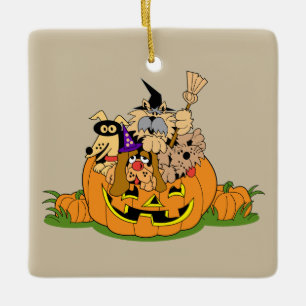 Niedliche Halloween-Hunde in einem Kürbis Keramikornament