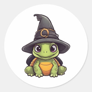Niedliche Halloweenschildkröte mit Hexenhut. Runder Aufkleber