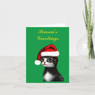 Niedliche Katze, die einen Weihnachtsmann trägt, Karte