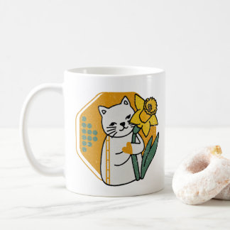 Niedliche Katze mit gelber affodischer Blume Kaffeetasse
