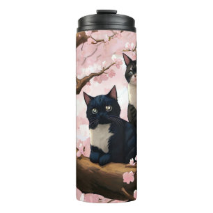 Niedliche Katzen auf einem Kirschblütenbaum Thermosbecher