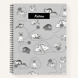 Niedliche Katzen spielen und ein schwaches Muster Notizbuch