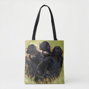 Niedliche Kleintiere   Drei Schimpansen umarmt Tasche