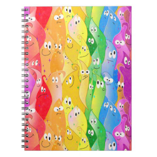 Niedliche Monster mit Regenbogen-Emotionsblocken i Notizblock