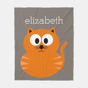Niedliche orange fette Katze mit dem Taupe Fleecedecke
