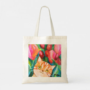 Niedliche Orange Tabby Katze mit farbenfrohen Tuli Tragetasche