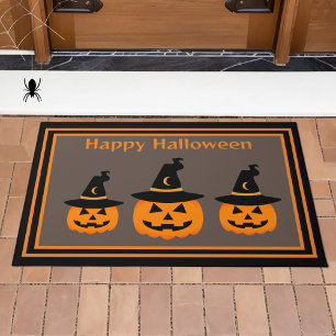 Niedliche Pumpkins tragen Hexenhutenhut-Halloween Fußmatte