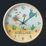 Niedliche und magische Meerjungfrauen Uhr<br><div class="desc">Diese niedliche und skurrile Kinderuhr besticht durch eine zauberhafte Meerjungfrau und einen blauen Schwanz. Die Uhr kann mit Ihrem Mädchennamen personalisiert werden,  das ideale Geschenk für alle Meerjungfrauen,  die tolle Dekoration für ein Kinderzimmer oder ein Kinderzimmer für ein kleines Mädchen.</div>