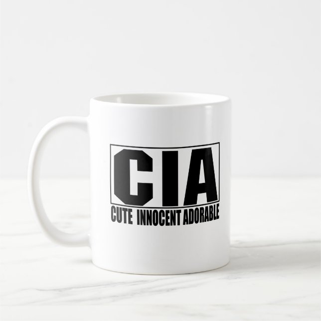 Niedliche unschuldige entzückende Tasse CIA (Links)