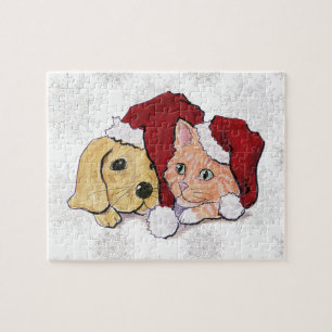 Niedliche Weihnachtsleder Welpe und Orange Tabby