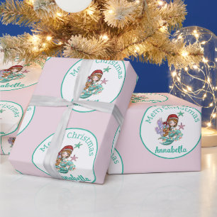 Niedliche Weihnachtsmeisterin in Weihnachtsmannmüt Geschenkpapier