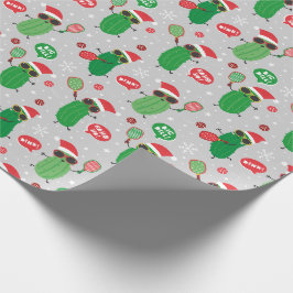 Niedliche Weihnachtsschlecken auf hellgrau Geschenkpapier