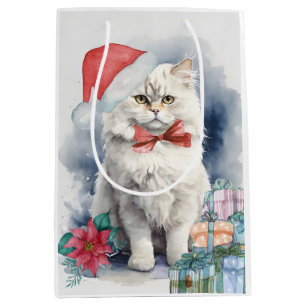 Niedliche weiße Katze in Weihnachtsmannmütze Gesch Mittlere Geschenktüte