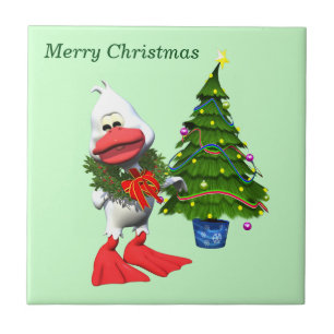 Niedliche weiße Weihnachtsente mit einem Kranz Fliese