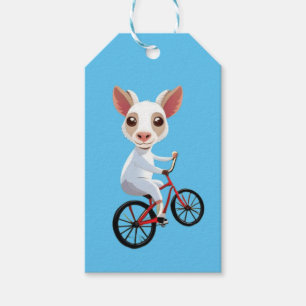 Niedliche, weiße Ziege auf dem Fahrrad Geschenkanhänger