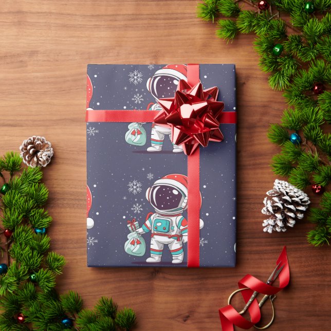 Niedlicher Astronaut mit Weihnachtshut in Galaxy Geschenkpapier (Feiertagsgeschenk)